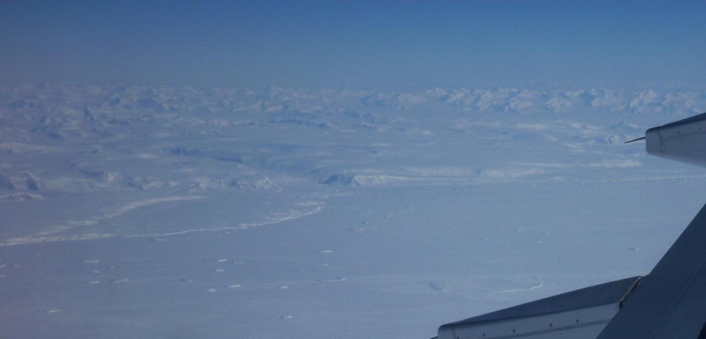 The edge of the Antarctic continent surrounded by many miles of sea ice. 