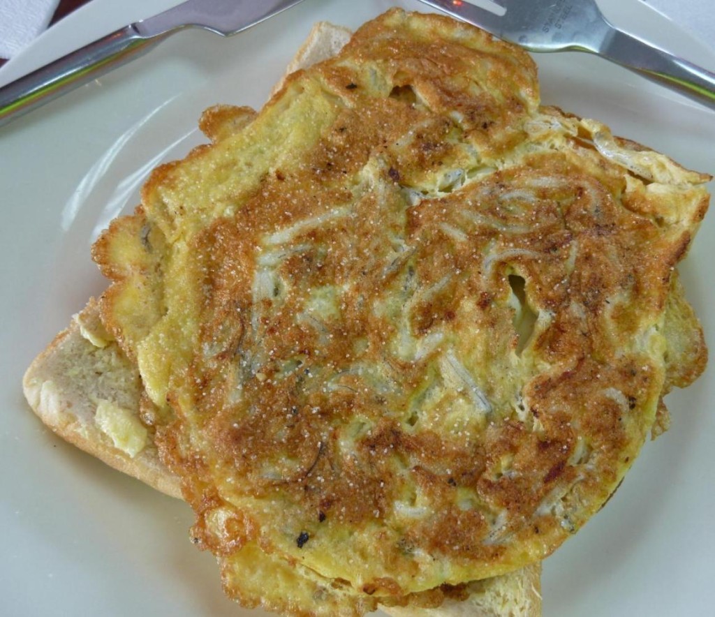 Sold...it was delicious. Pan fried in light batter and served over a slice of bread. Although the eyes staring at me were a bit creepy. 