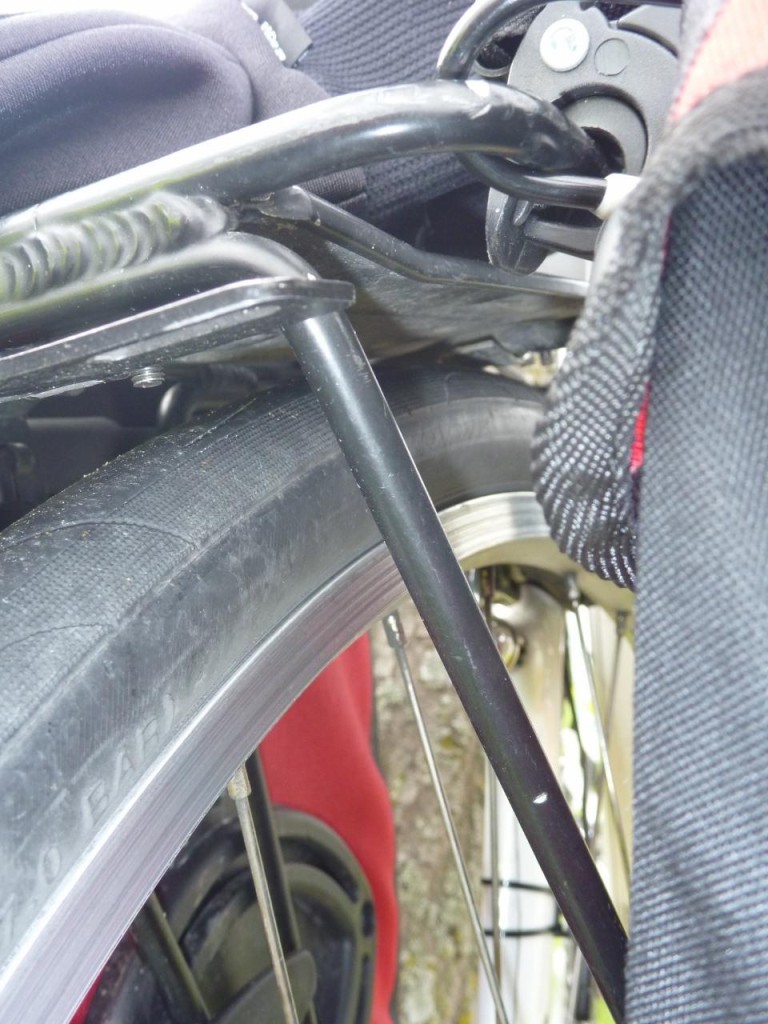 The metal bracket hitting the tire. 