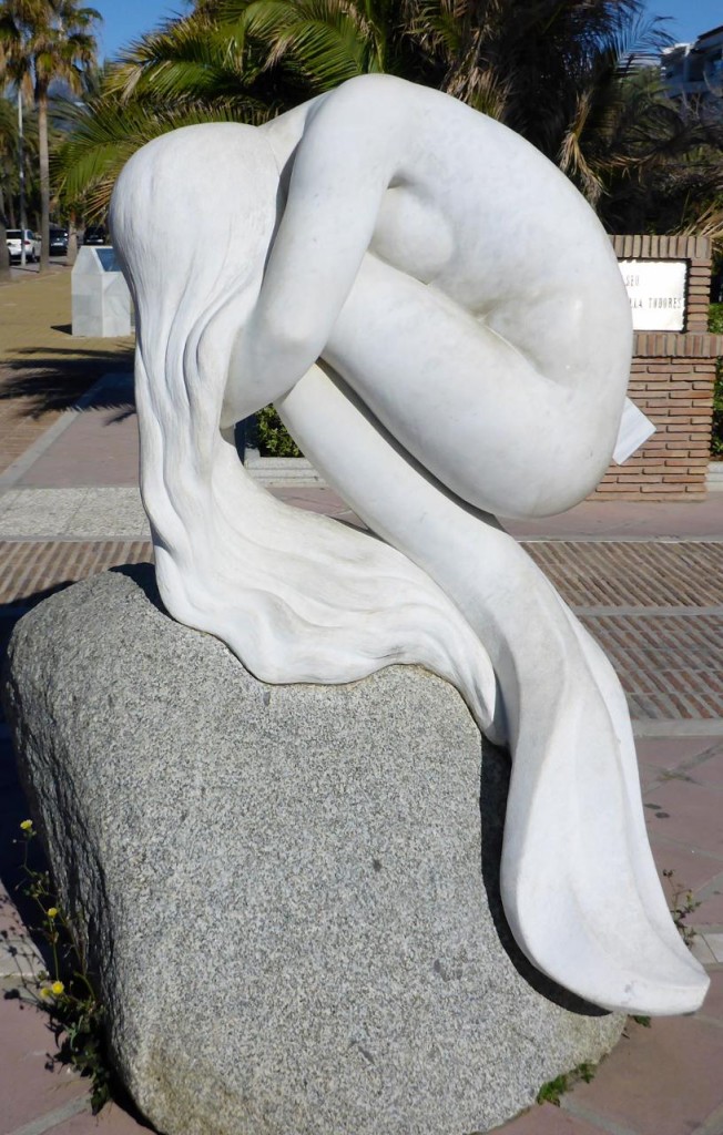 A marble sculptor along the boardwalk. 