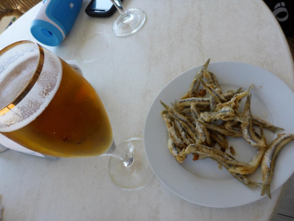 Beer is served with tapas this being fried sardines. They really are good. 