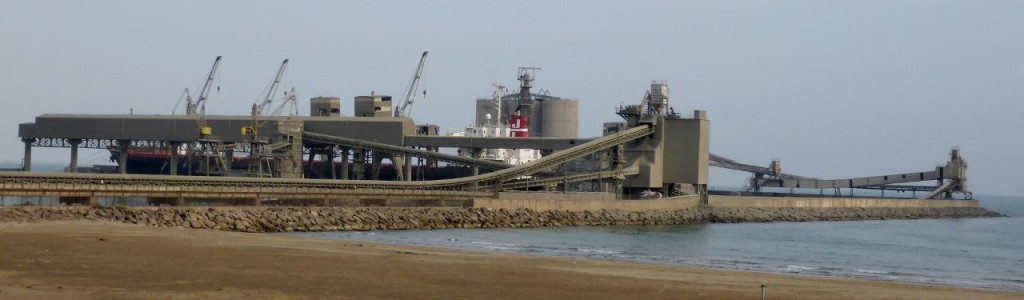 A cement port built between rock jetties. 