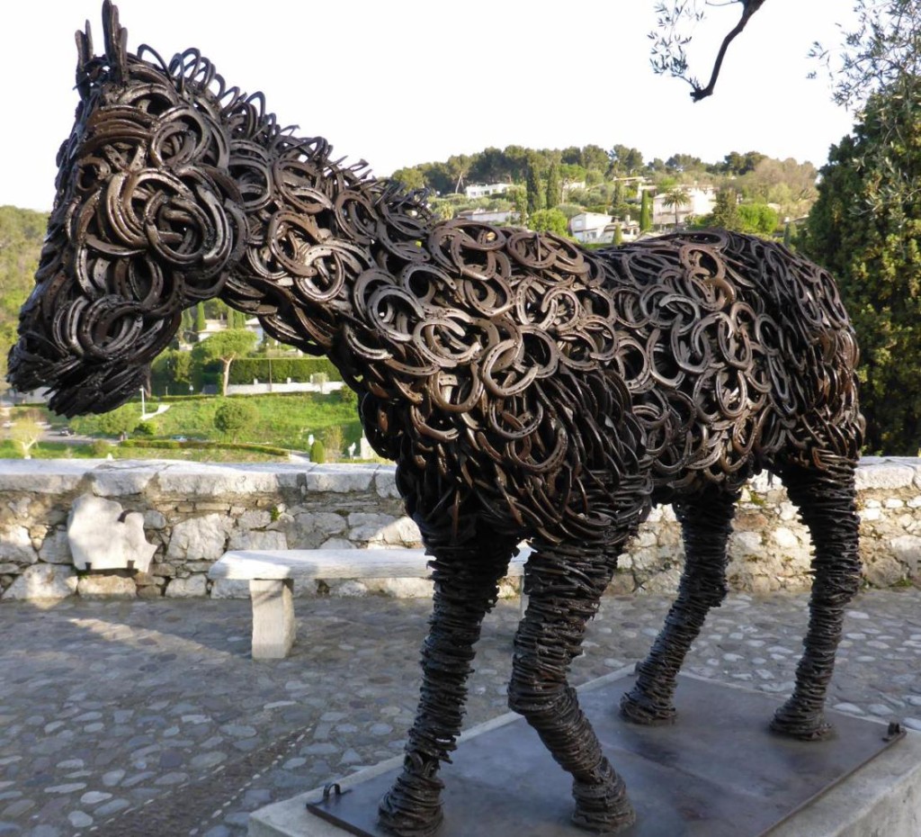 A horse fashioned out of horse shoes. 