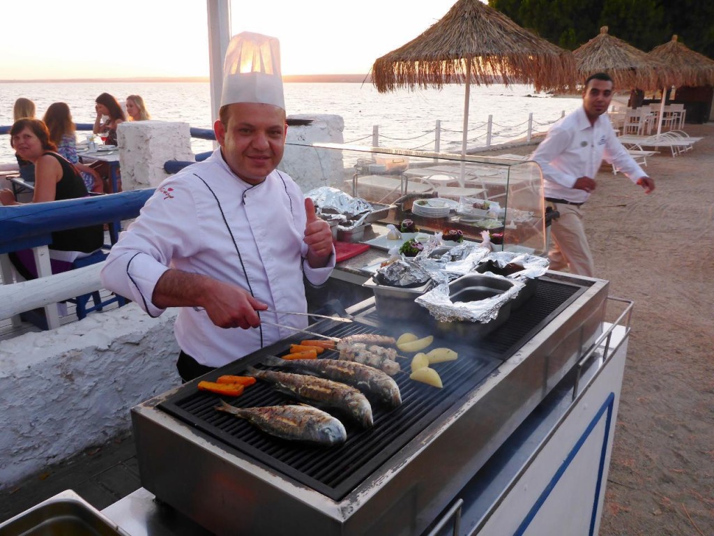 The chef grilling. 