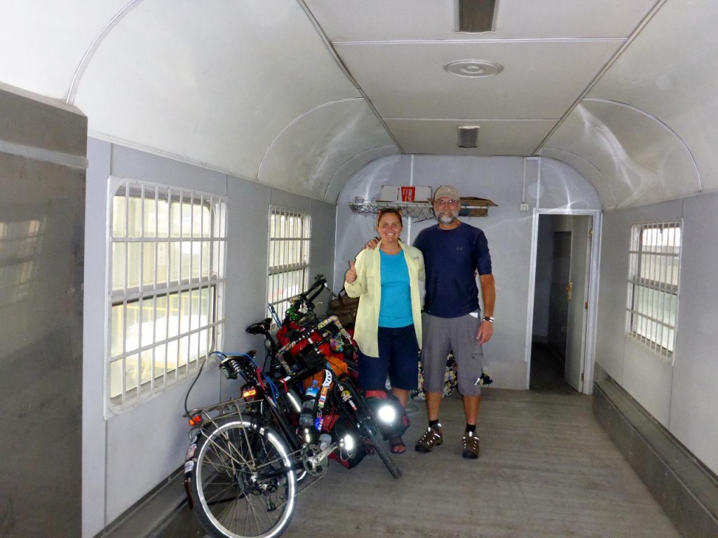 Loading our bikes into the baggage car. Plenty of room. We don't understand why there was were so many officials that said no. 