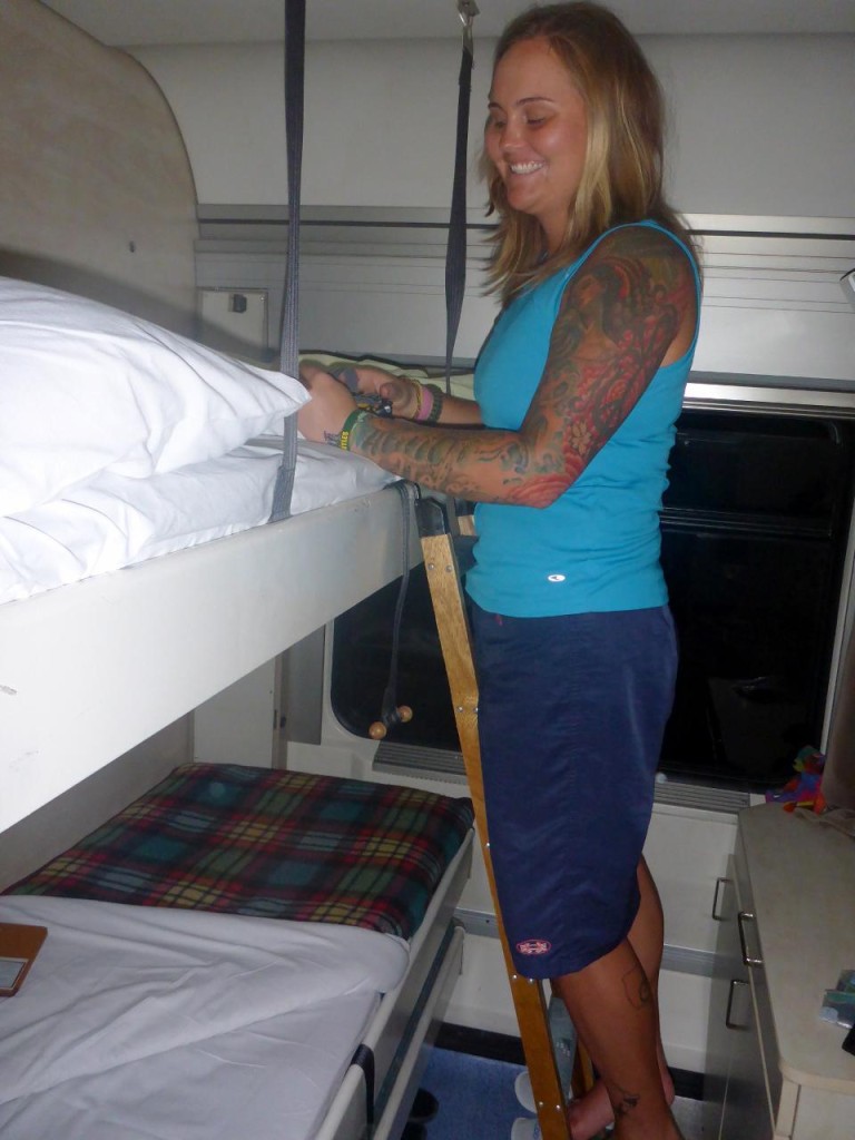 Preparing the bunks for sleep. 