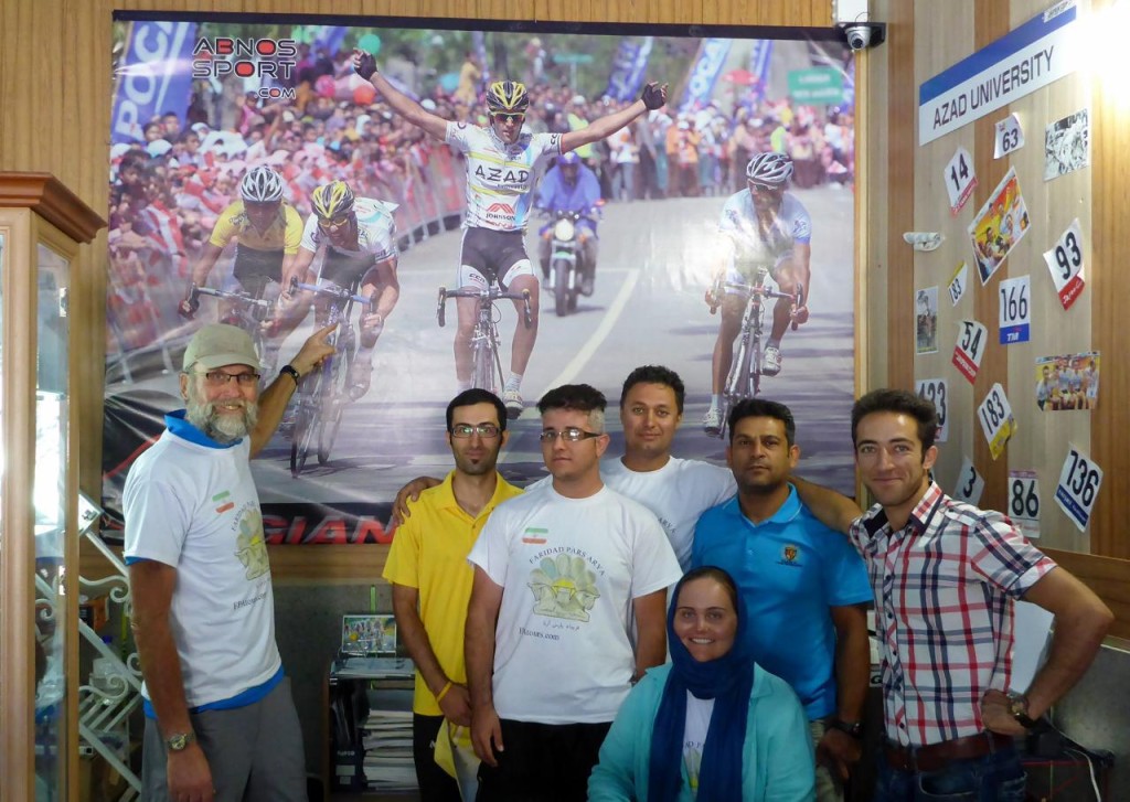 On the right is bike shop owner and racer Farhad. Next to him is the Iranian National Cycling team head coach. I am pointing to a picture of Farhad. 
