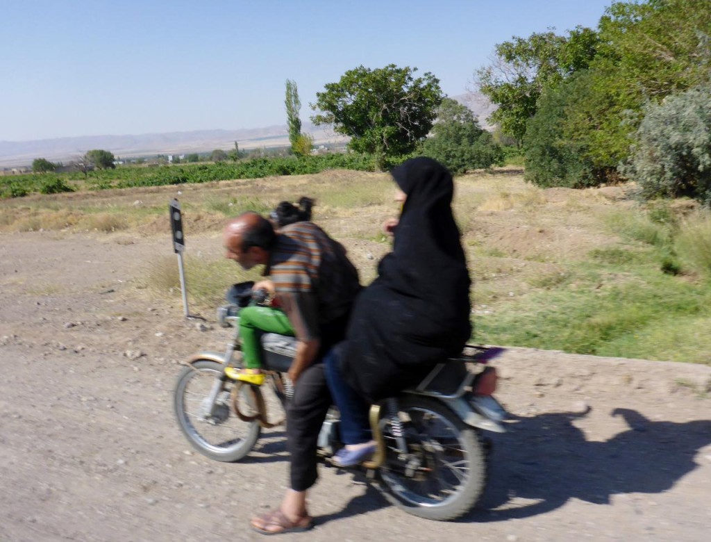 We have seen four riding on these bikes. Yesterday we actually saw a mother sitting on the back holding her baby and a son sitting in front of the driving father!In this picture the daughter is in front. 