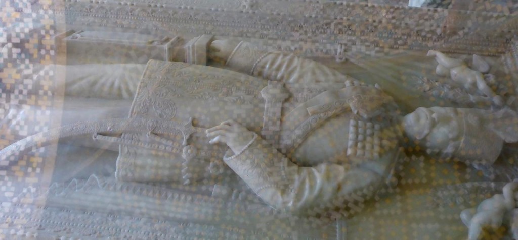 The tomb of one of the kings under a sheet of glass. 