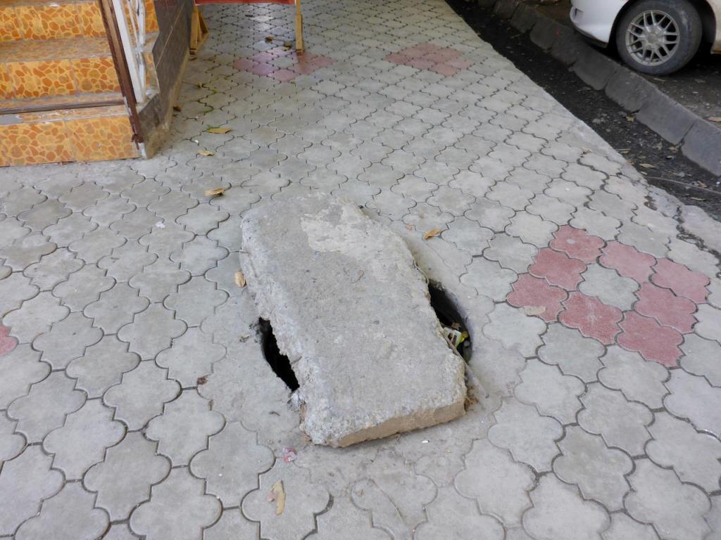 From one tripping hazard to another. This block covering the hole has probably been here for years. 