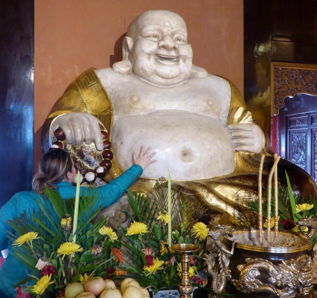 Jocelyn rubbed the Buddha belly. 