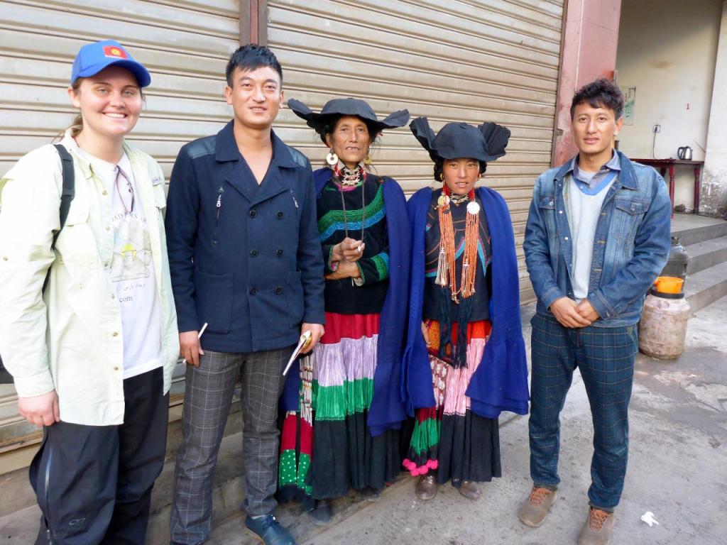 Two ladies in traditional dress and two of our excellent helpers. On the right is the local university English teacher with one of his students on the right. 