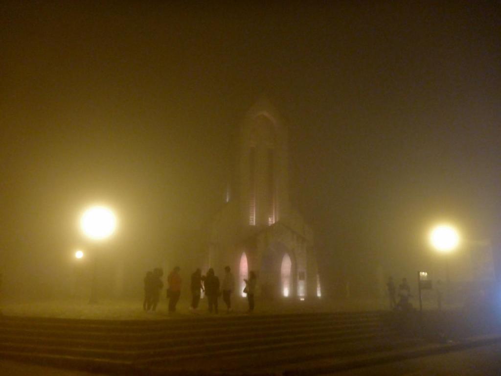 Mid-day in Sa Pa is autumn as the fog rolls in. This is the local Catholic church. 