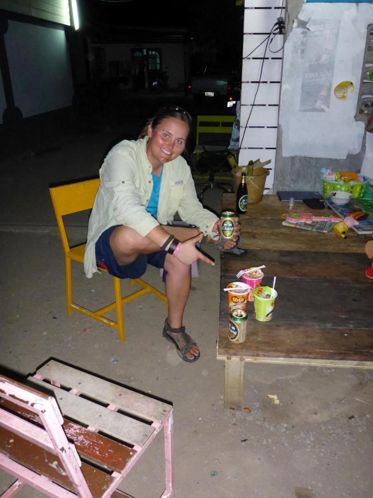 There were no restaurants open near our bungalow. The local market guy heated water for our noodle soup bowls and sat us next to their home. The mosquitoes were awful but the Thai friends we met were fun. 