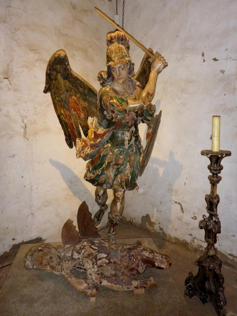 Saint Michael slaying the devil. An 18th century wood statue. 