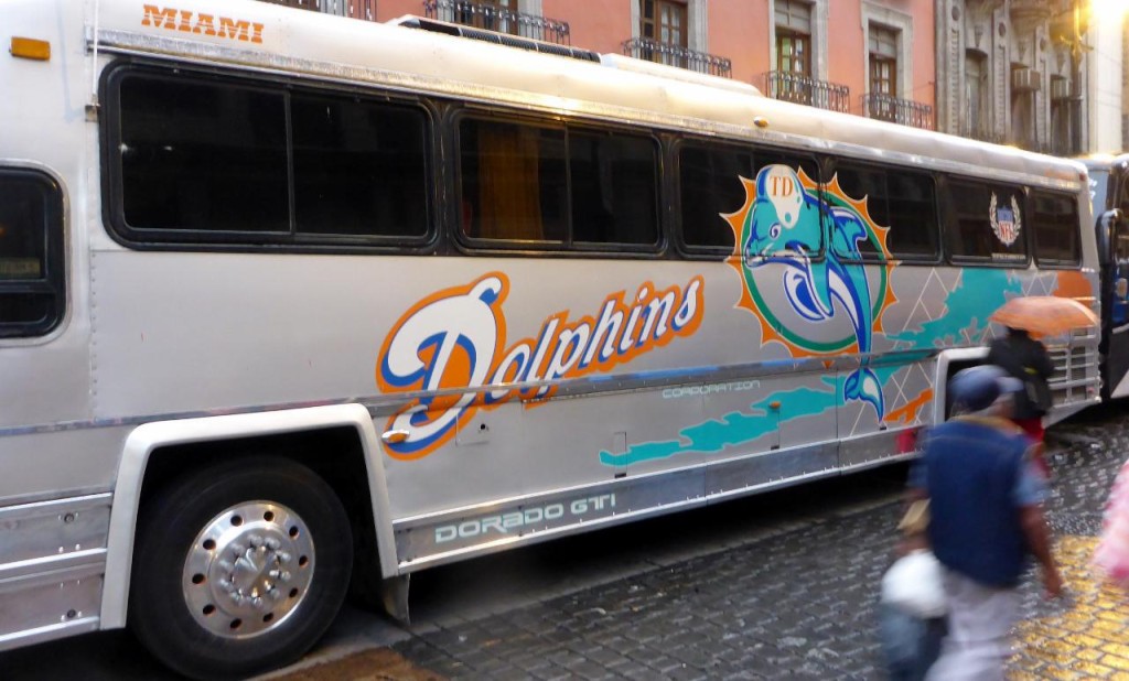 The Mexicans bought an old Miami Dolphins bus. 