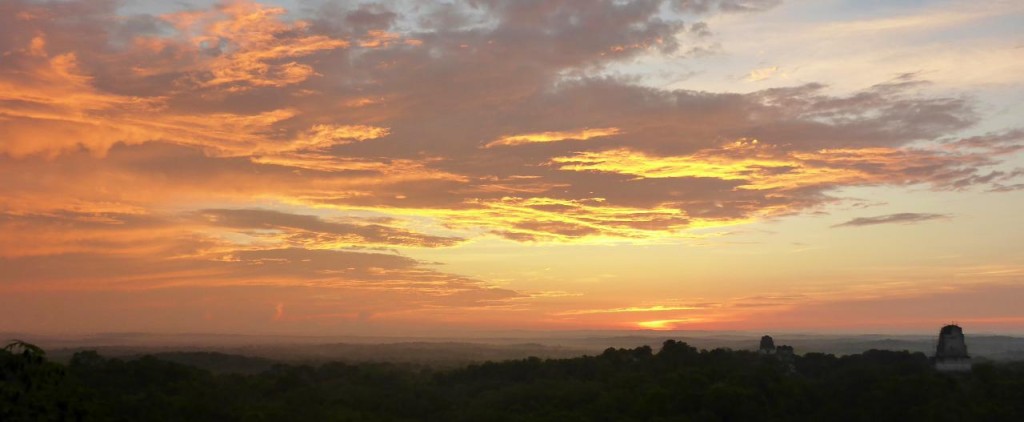 A beautiful sunrise high atop a Mayan pyramid at the ancient of Tikal. We along with several others sat in quiet and awe as the sun rose over the valley and ancient Mayan structures. 
