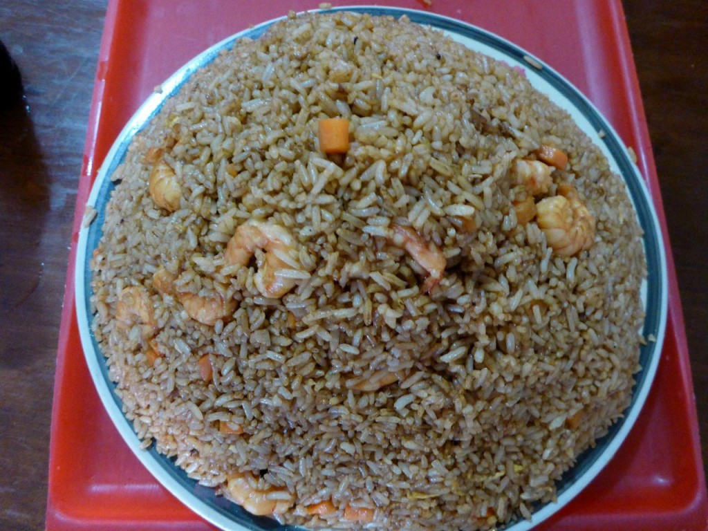 A simple meal turned huge. The fried rice and shrimp are piled about 5 inches. We make it a point to share a meal. 
