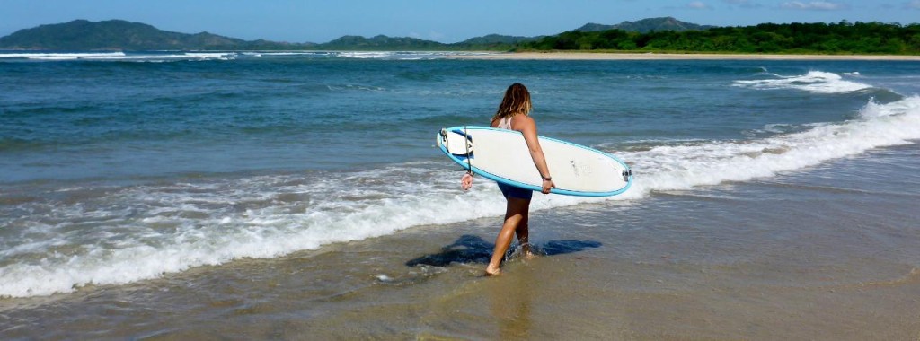 Surfing at Tamarindo Beach, Costa Rica. 