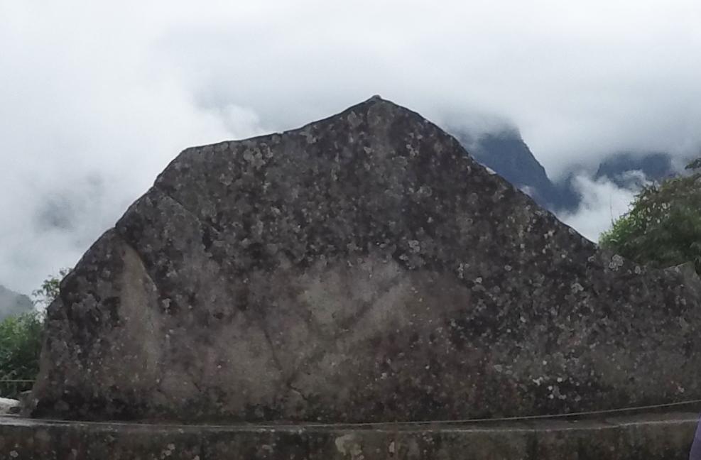 This stone was carved to resemble the mountain profile behind it. 