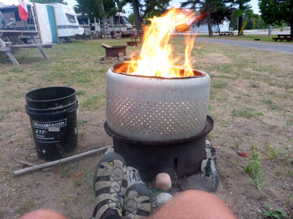 A fine fire pit from a transport wheel and dryer drum.